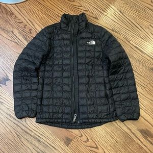The North Face girls black quilted jacket. Size M (10-12).